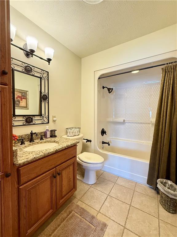 334 Manito Trail Mercer, PA 16137 - Photo 29 of 49 a bathroom with a granite countertop toilet sink and mirror