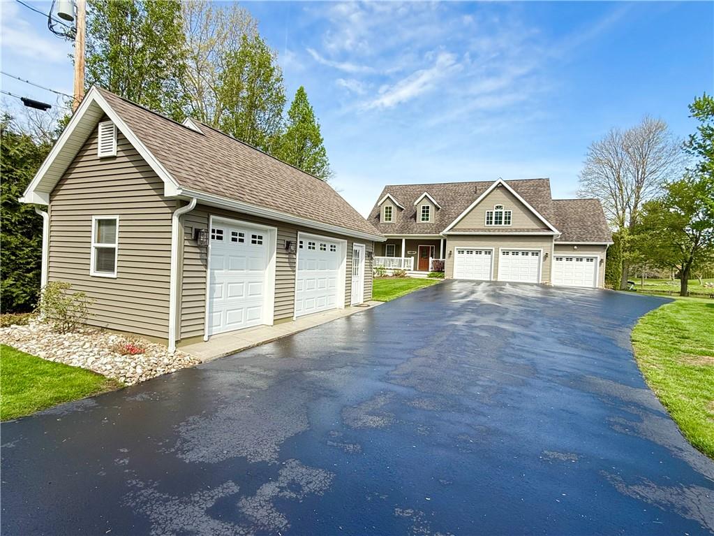 334 Manito Trail Mercer, PA 16137 - Photo 3 of 49 a front view of a house with a yard and garage