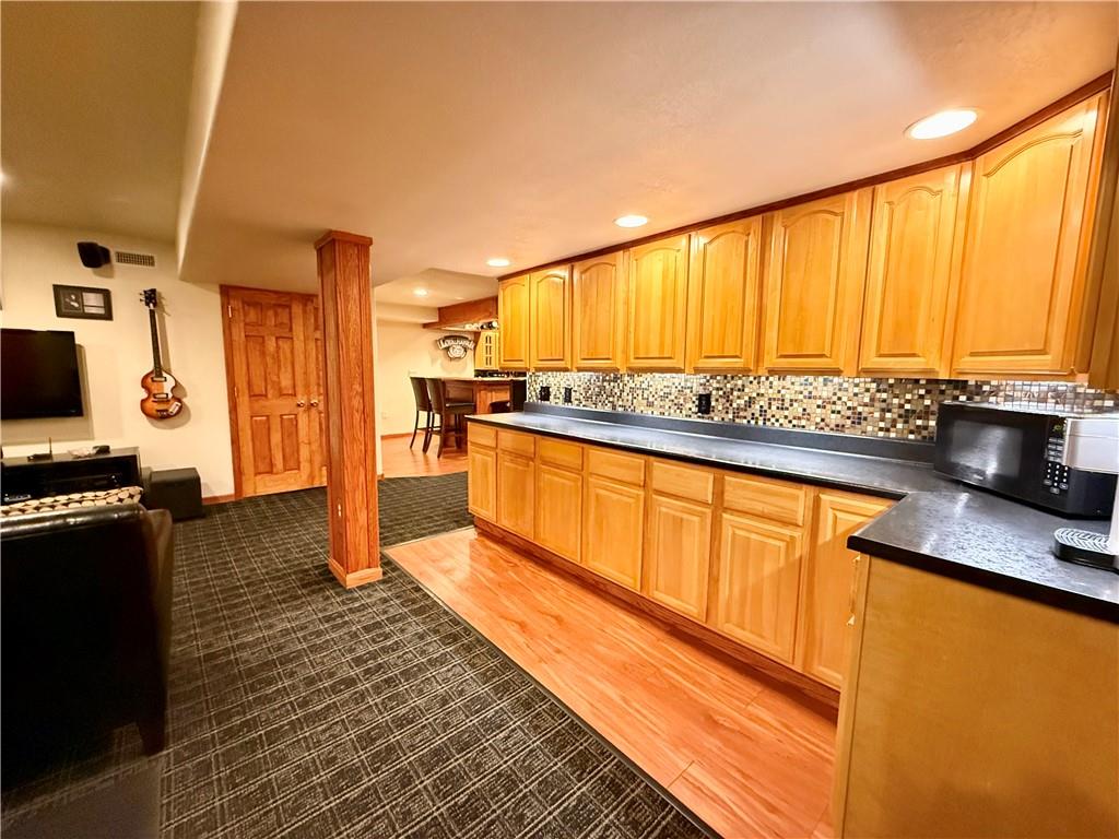 334 Manito Trail Mercer, PA 16137 - Photo 33 of 49 a kitchen with stainless steel appliances granite countertop sink stove and refrigerator