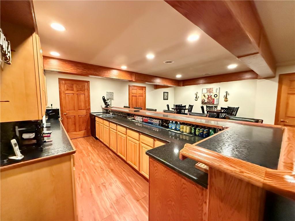 334 Manito Trail Mercer, PA 16137 - Photo 35 of 49 a kitchen with stainless steel appliances granite countertop a sink a stove counter space and cabinets