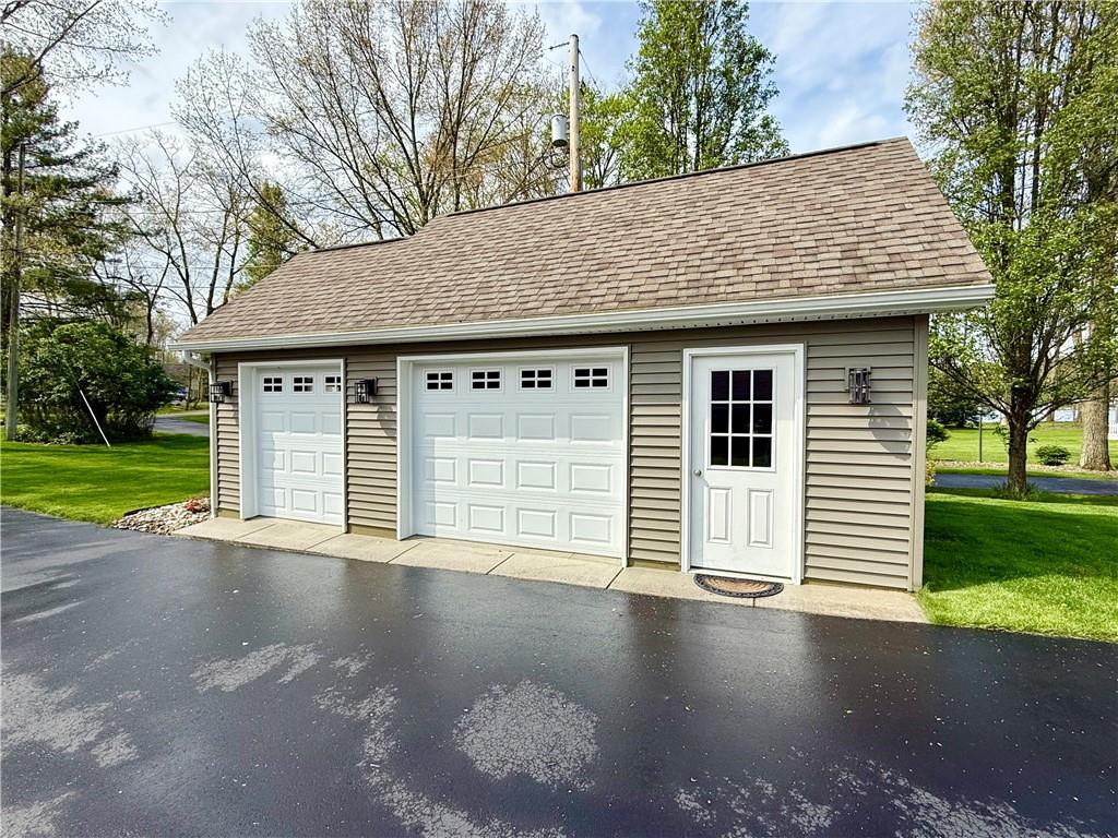 334 Manito Trail Mercer, PA 16137 - Photo 4 of 49 a front view of a house with a garden and yard