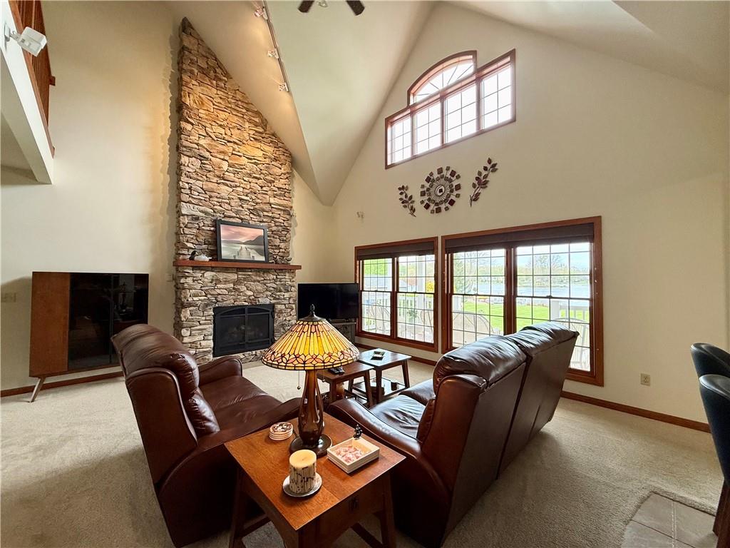 334 Manito Trail Mercer, PA 16137 - Photo 8 of 49 a living room with furniture a fireplace and a large window