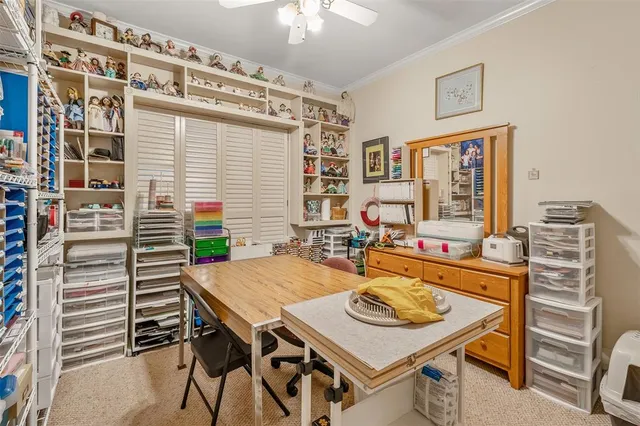 a view of a dining room with furniture and window