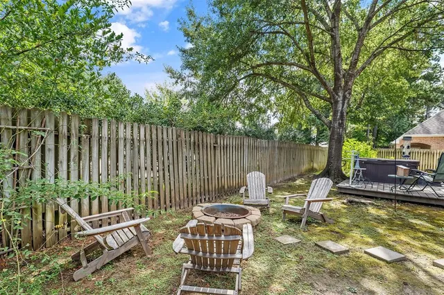 a view of a patio with two chairs and a table