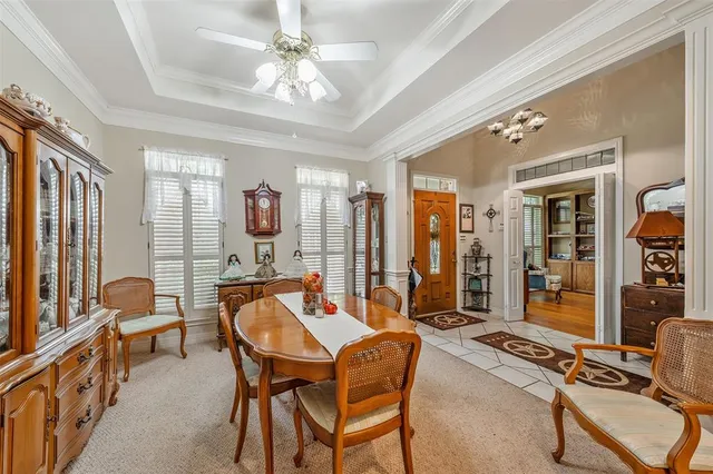 a dining room with furniture and window