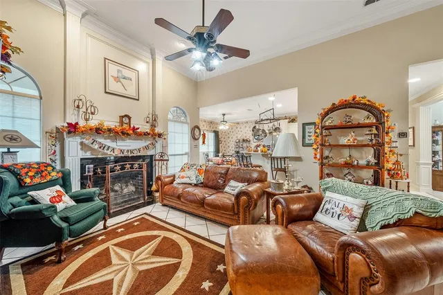 a living room with furniture a rug and a chandelier