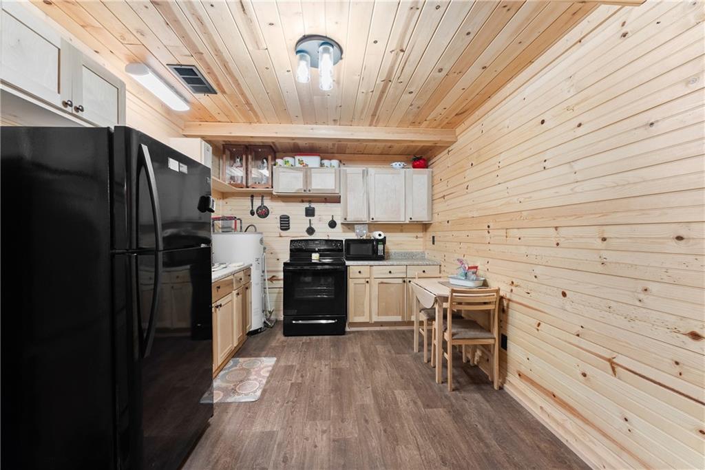 318 Jim Grizzle Road Royston, GA 30662 - Photo 12 of 56 a kitchen with a refrigerator and a stove
