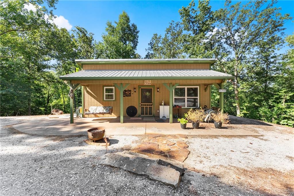 318 Jim Grizzle Road Royston, GA 30662 - Photo 2 of 56 a front view of a house with sitting area and garden