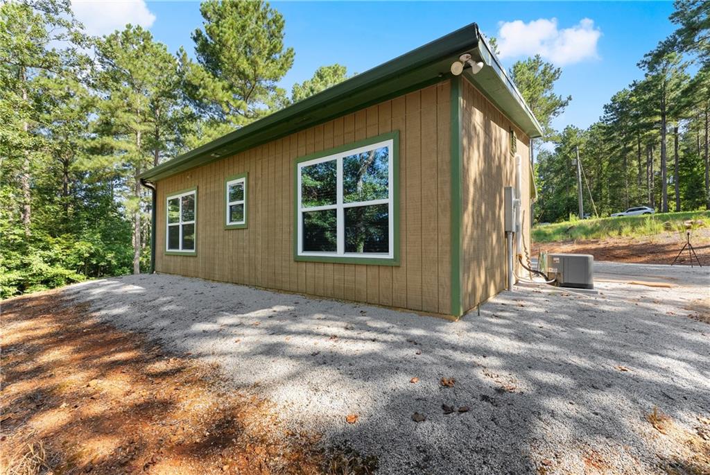 318 Jim Grizzle Road Royston, GA 30662 - Photo 21 of 56 a view of backyard with large trees and a small yard