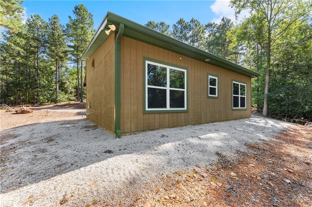 318 Jim Grizzle Road Royston, GA 30662 - Photo 22 of 56 a front view of a house with a yard and garage