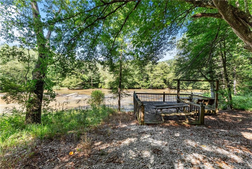 318 Jim Grizzle Road Royston, GA 30662 - Photo 30 of 56 a view of a bench in a backyard