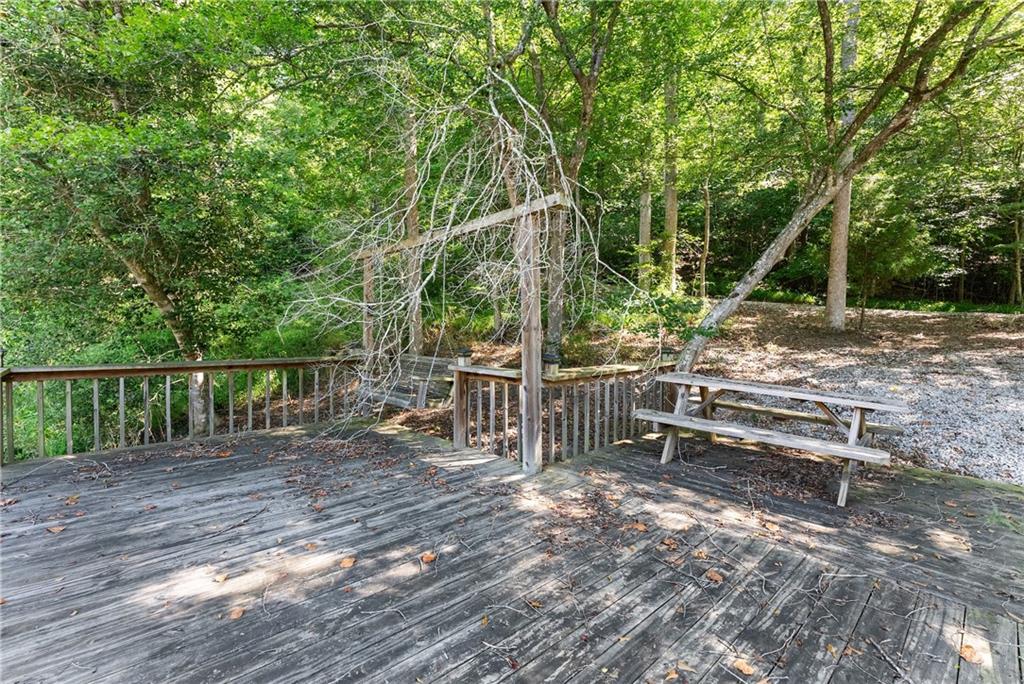 318 Jim Grizzle Road Royston, GA 30662 - Photo 33 of 56 a view of park with wooden fence and trees