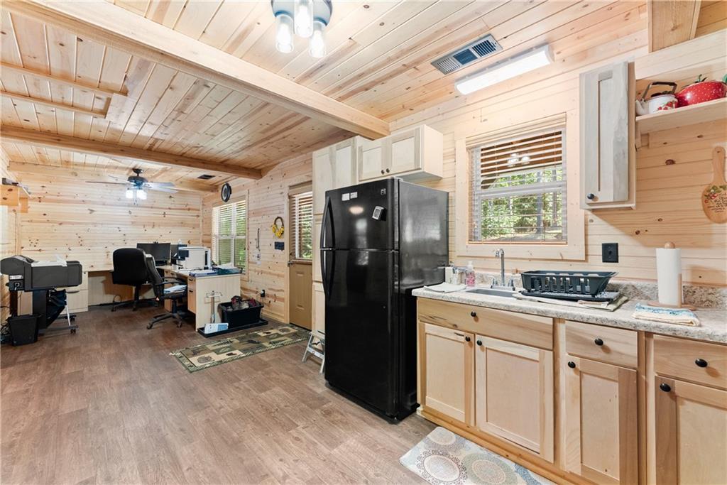 318 Jim Grizzle Road Royston, GA 30662 - Photo 10 of 56 a kitchen with refrigerator and window