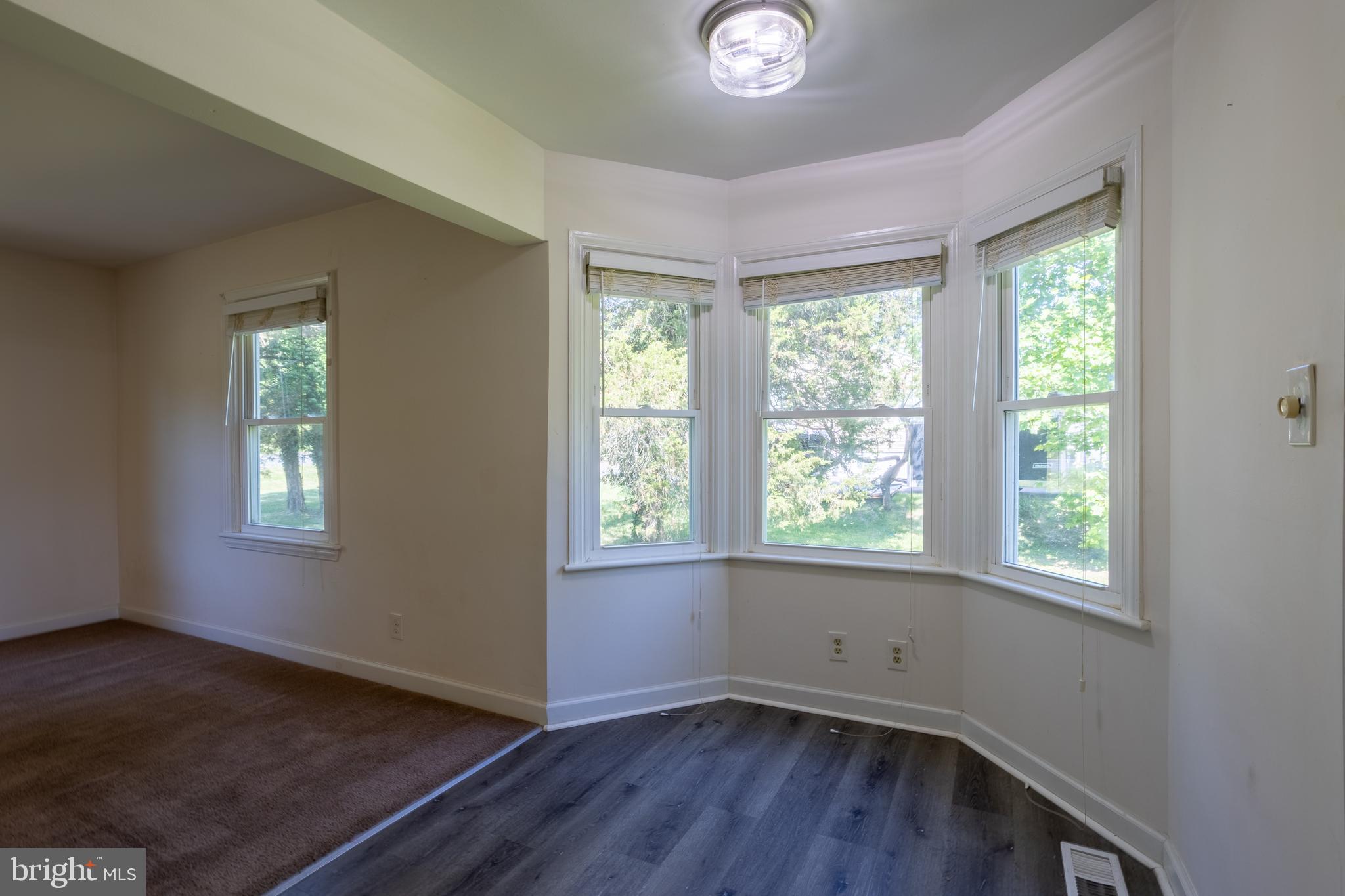 3612 Churchville Road Aberdeen, MD 21001 - Photo 7 of 49 a view of an empty room with wooden floor and a window