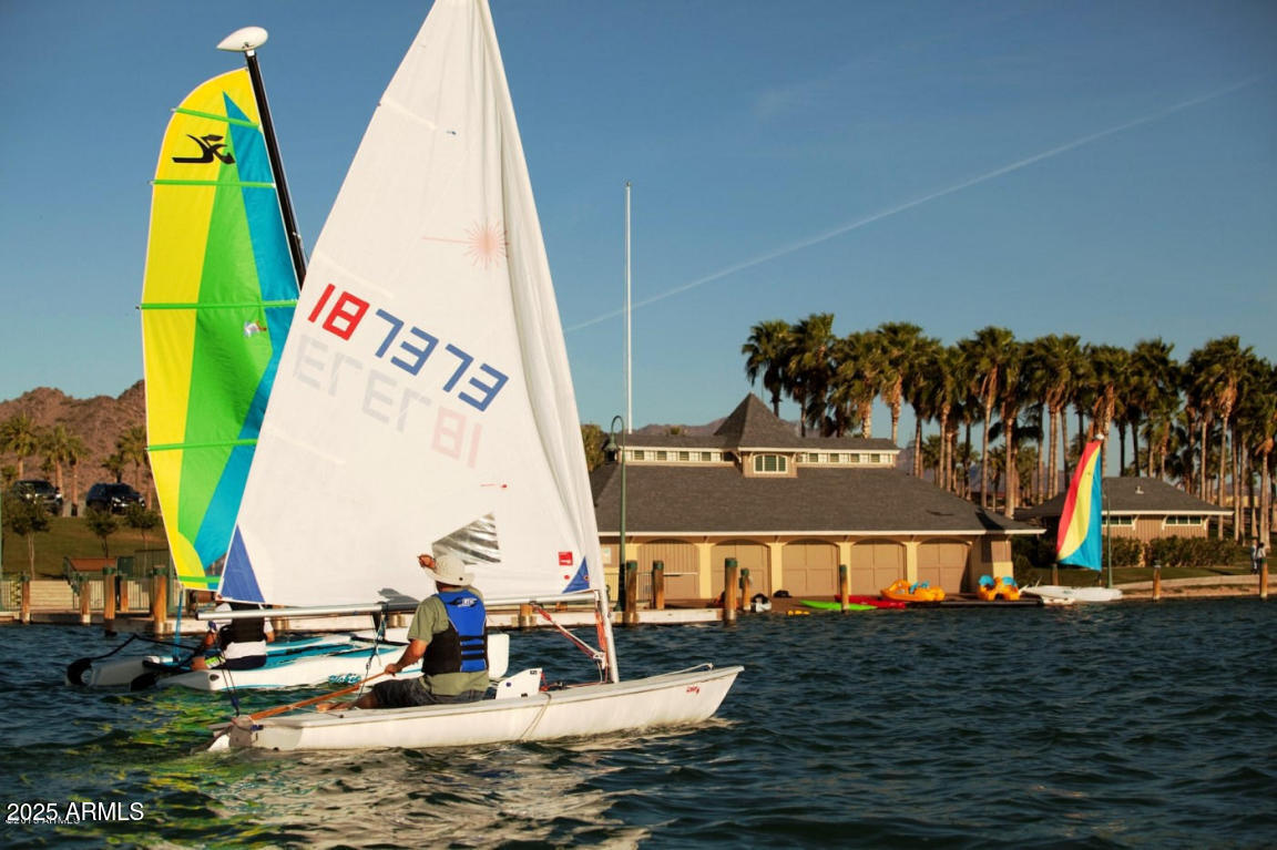 8564 San Filipe Drive, Unit 4 Goodyear, AZ 85338 - Photo 5 of 15 a view of small pool with lawn chairs