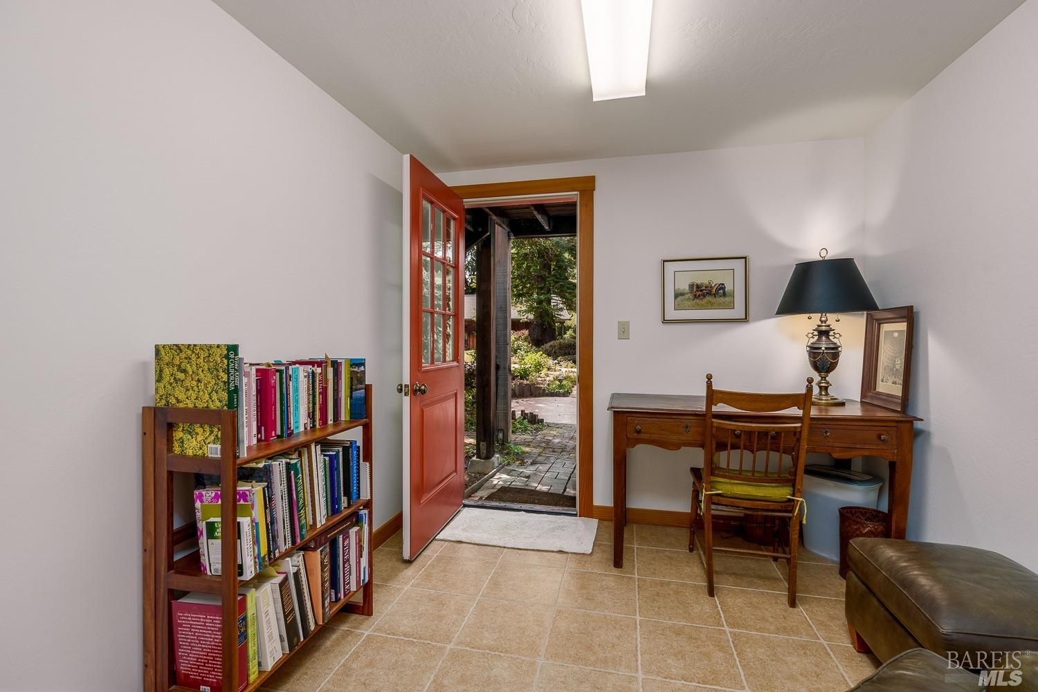 2151 Guntly Road Philo, CA 95466 - Photo 35 of 43 a view of a workspace with furniture and a book shelf