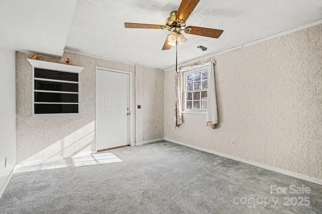 a view of an empty room with a window