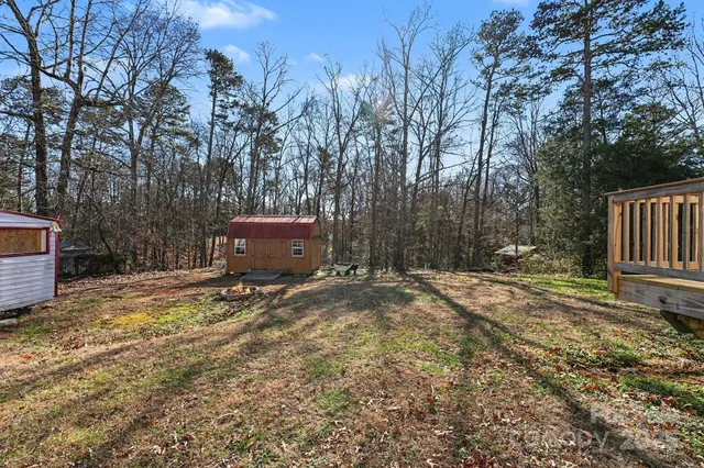 a backyard of a house with trees and outdoor space