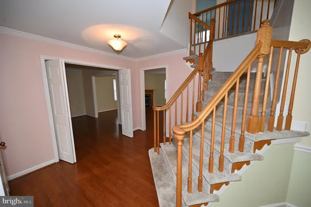 a view of livingroom with hardwood floor and kitchen