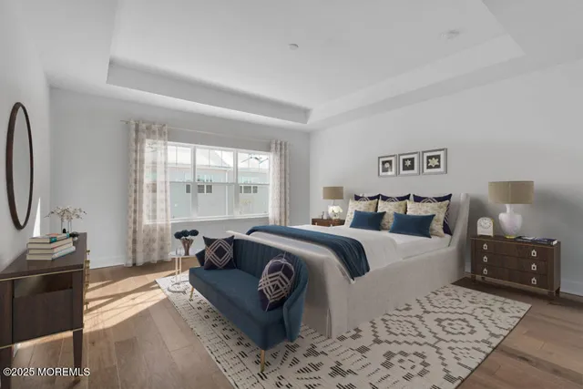 a bedroom with bed and a couch