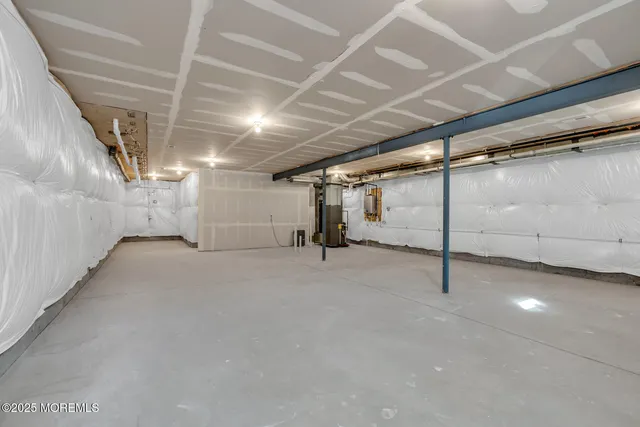 a view of empty room with wooden ceiling