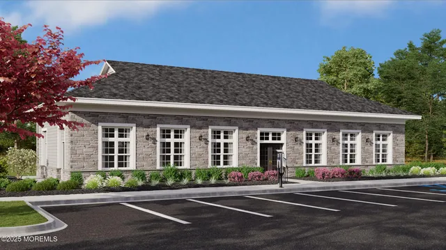 a front view of a building with garden