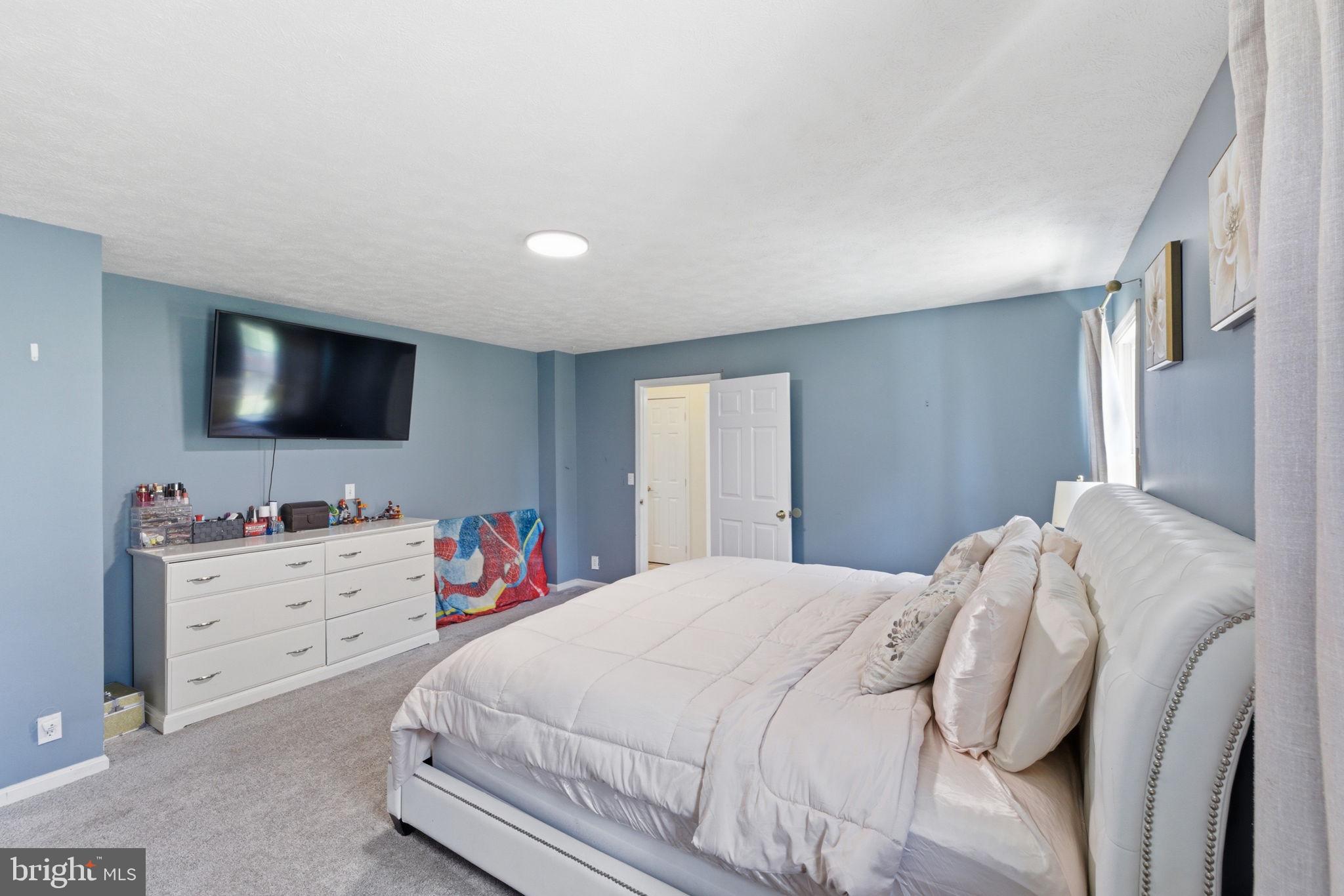860 Hartwood Road Fredericksburg, VA 22406 - Photo 15 of 24 Serene blue-hued bedroom retreat.