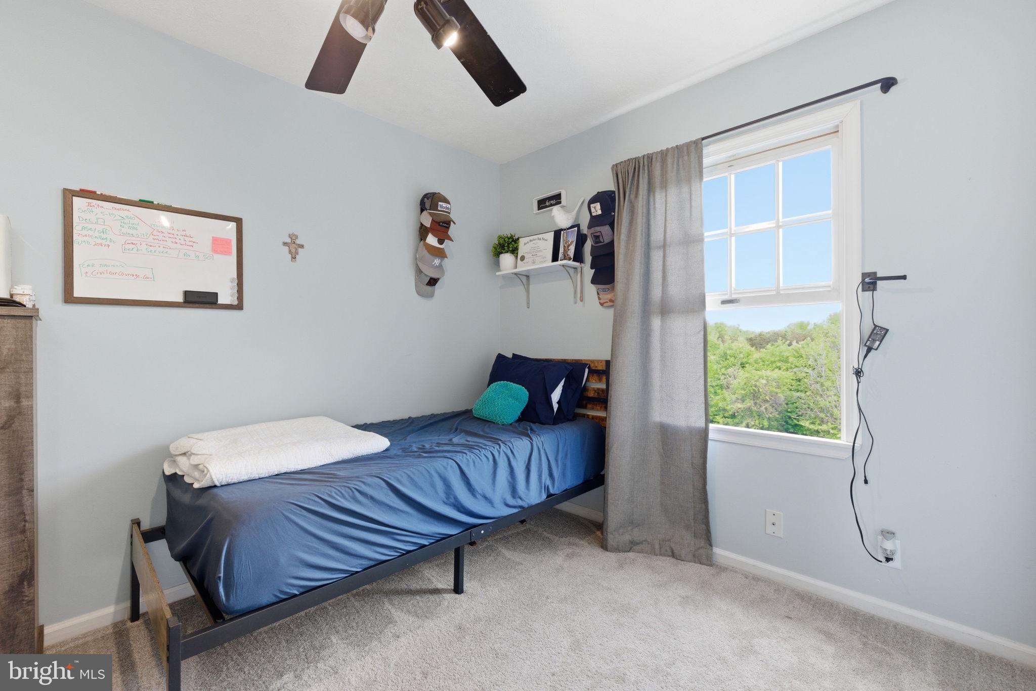 860 Hartwood Road Fredericksburg, VA 22406 - Photo 16 of 24 Cozy bedroom with serene views.