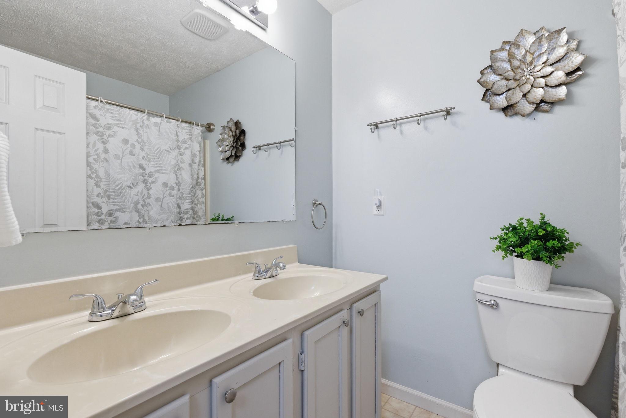 860 Hartwood Road Fredericksburg, VA 22406 - Photo 17 of 24 Serene bathroom with elegant accents.