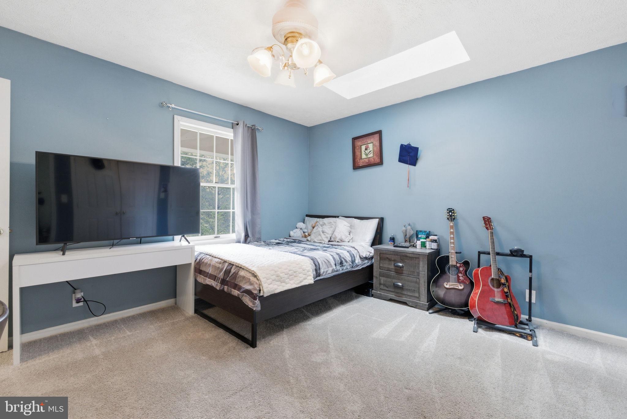 860 Hartwood Road Fredericksburg, VA 22406 - Photo 18 of 24 Serene blue-hued bedroom retreat.