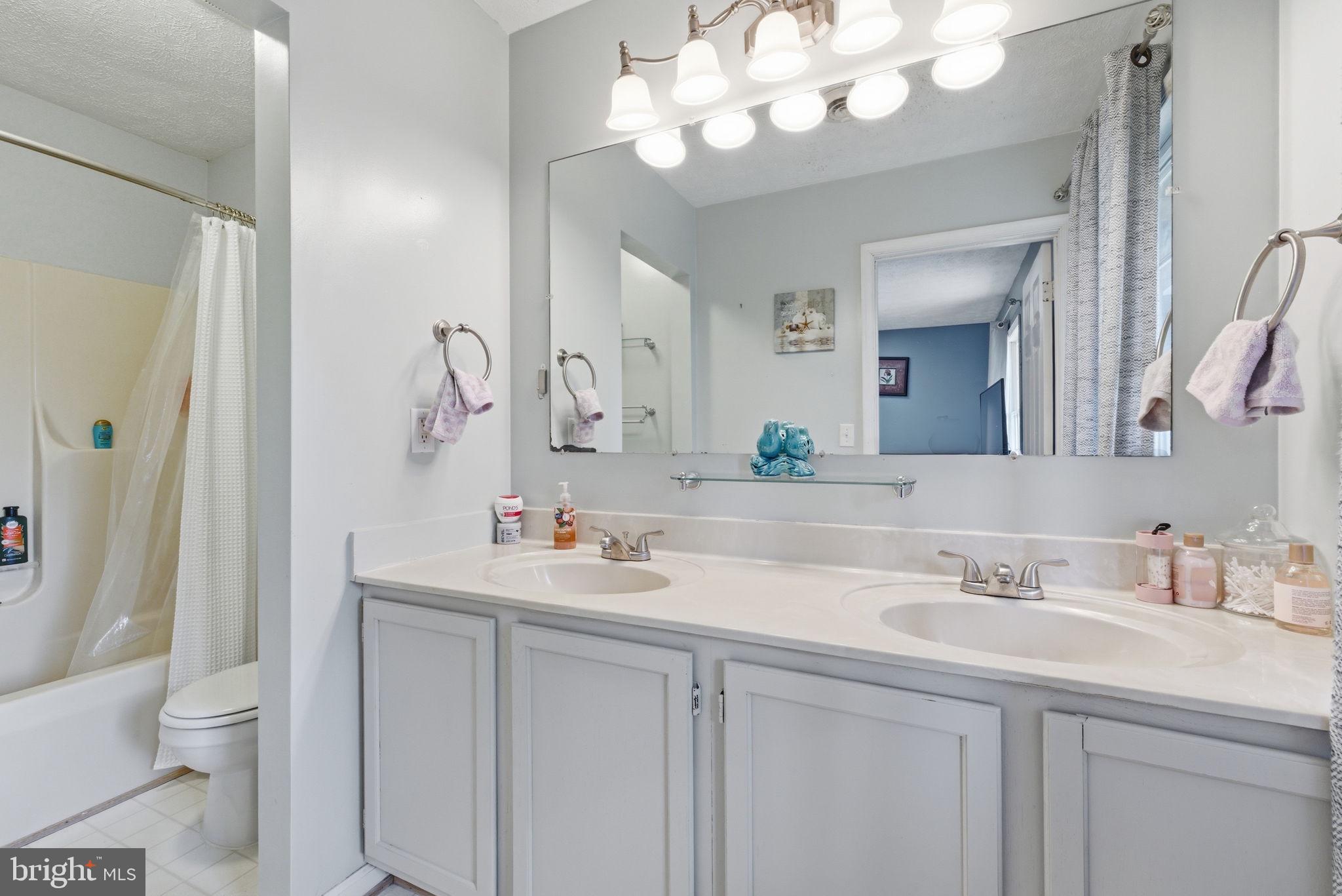 860 Hartwood Road Fredericksburg, VA 22406 - Photo 19 of 24 Serene dual-sink bathroom retreat.