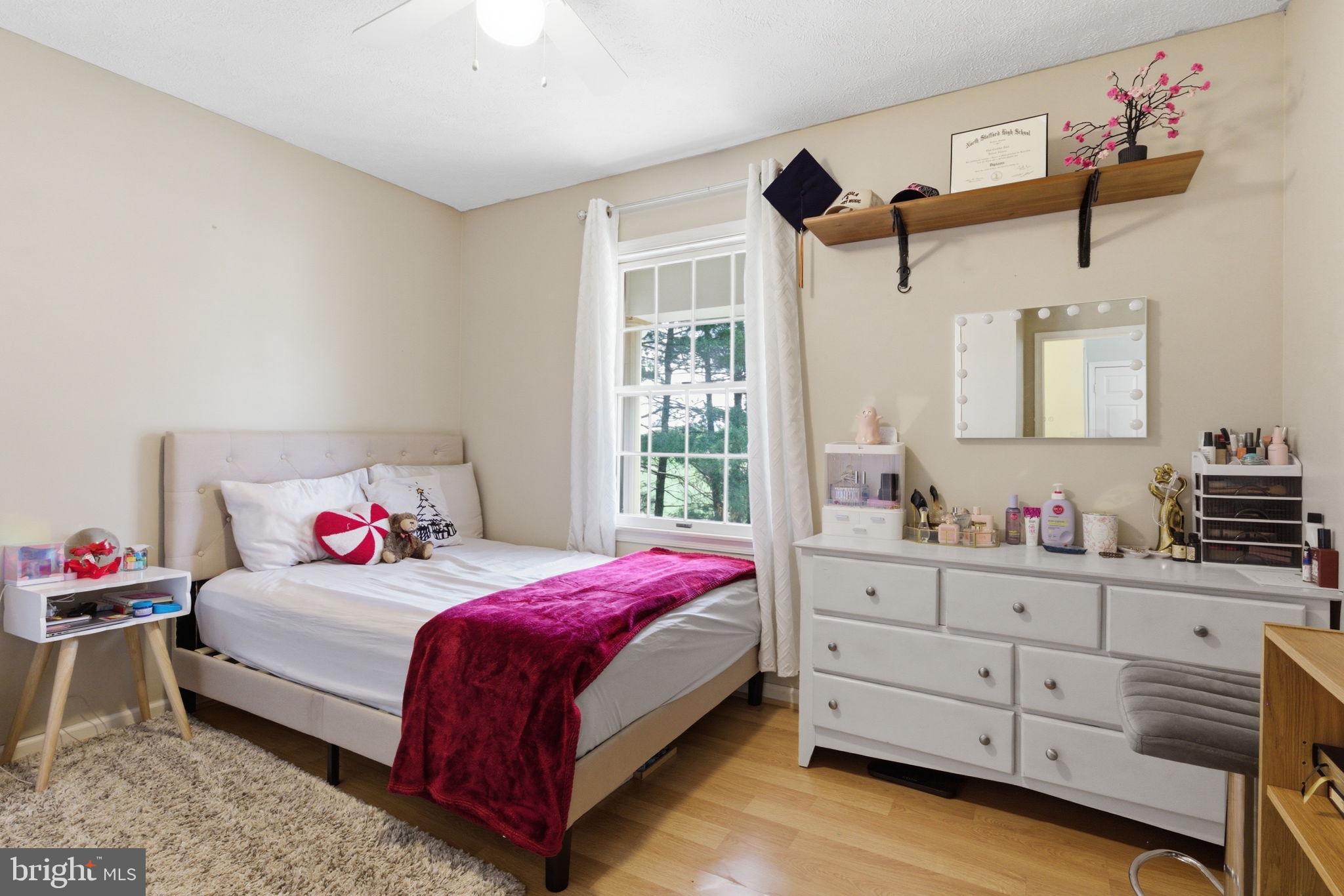 860 Hartwood Road Fredericksburg, VA 22406 - Photo 21 of 24 Cozy bedroom with natural light.