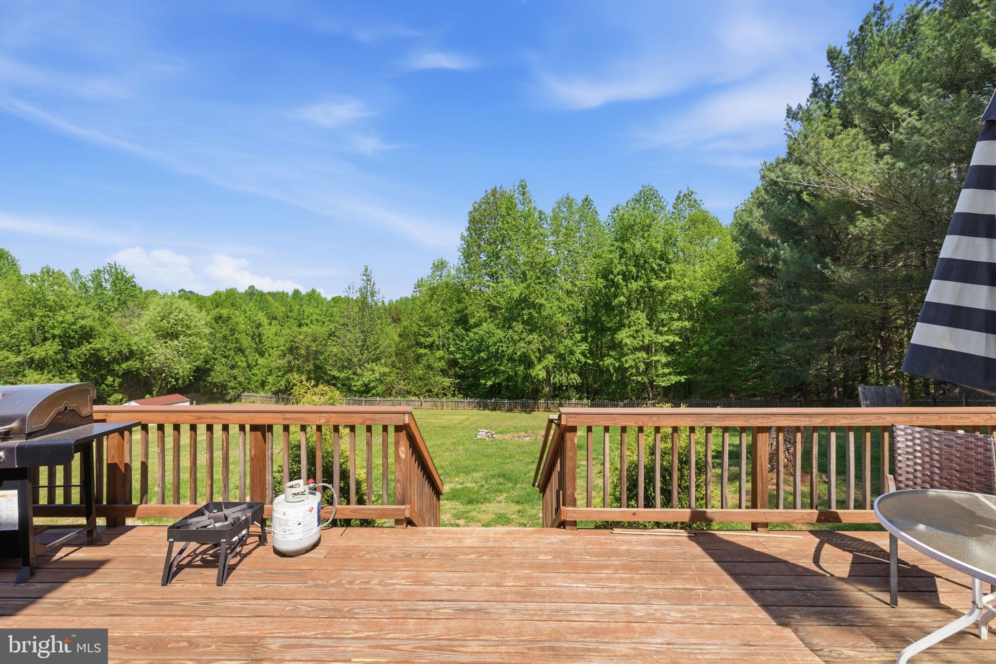 860 Hartwood Road Fredericksburg, VA 22406 - Photo 22 of 24 Serene deck with lush green views.