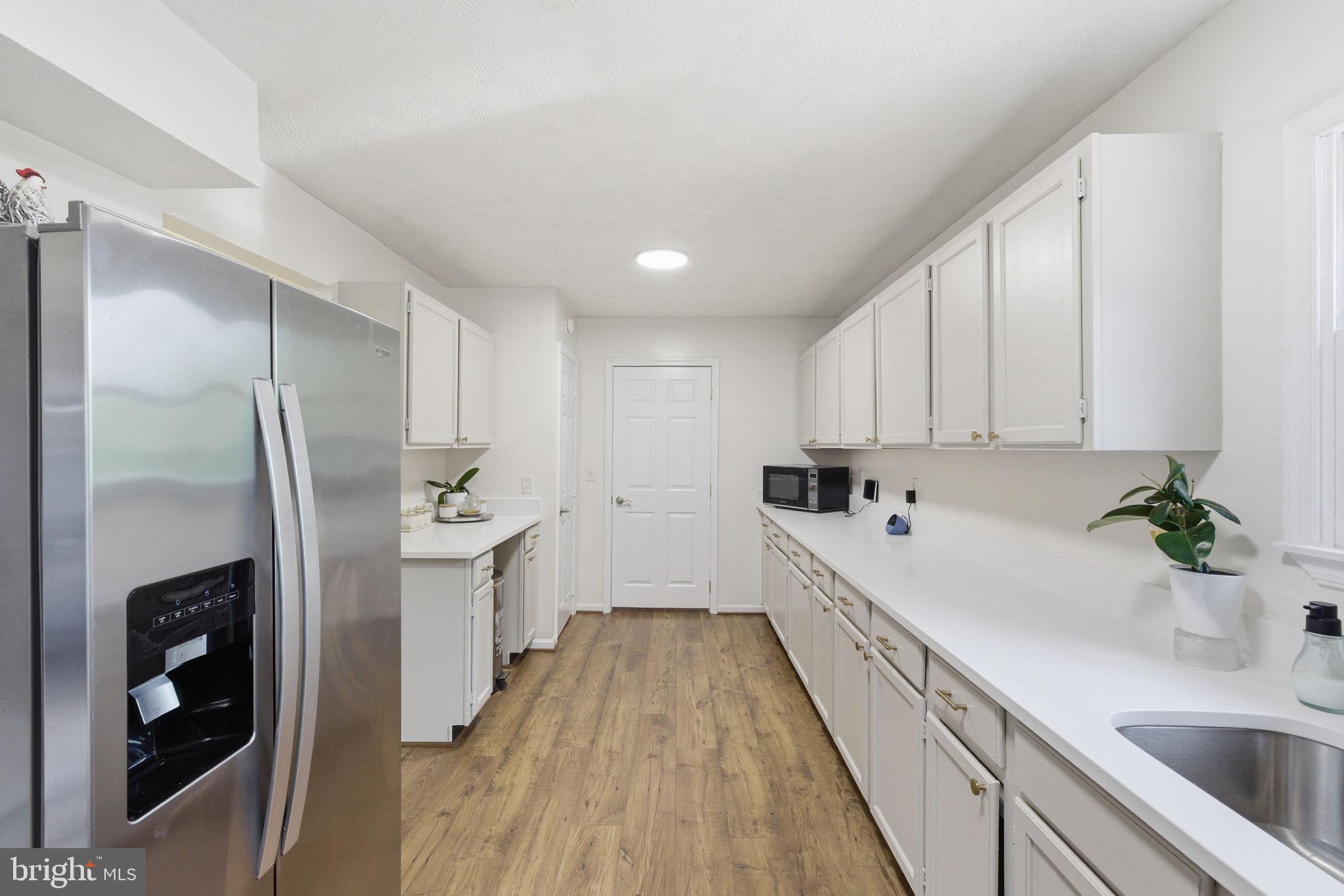 860 Hartwood Road Fredericksburg, VA 22406 - Photo 8 of 24 Bright and airy modern kitchen space.