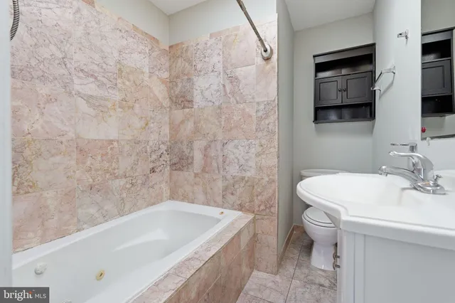 a bathroom with a sink and a bathtub