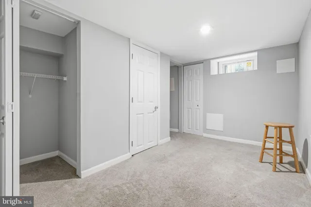 a view of a patio with iron fence