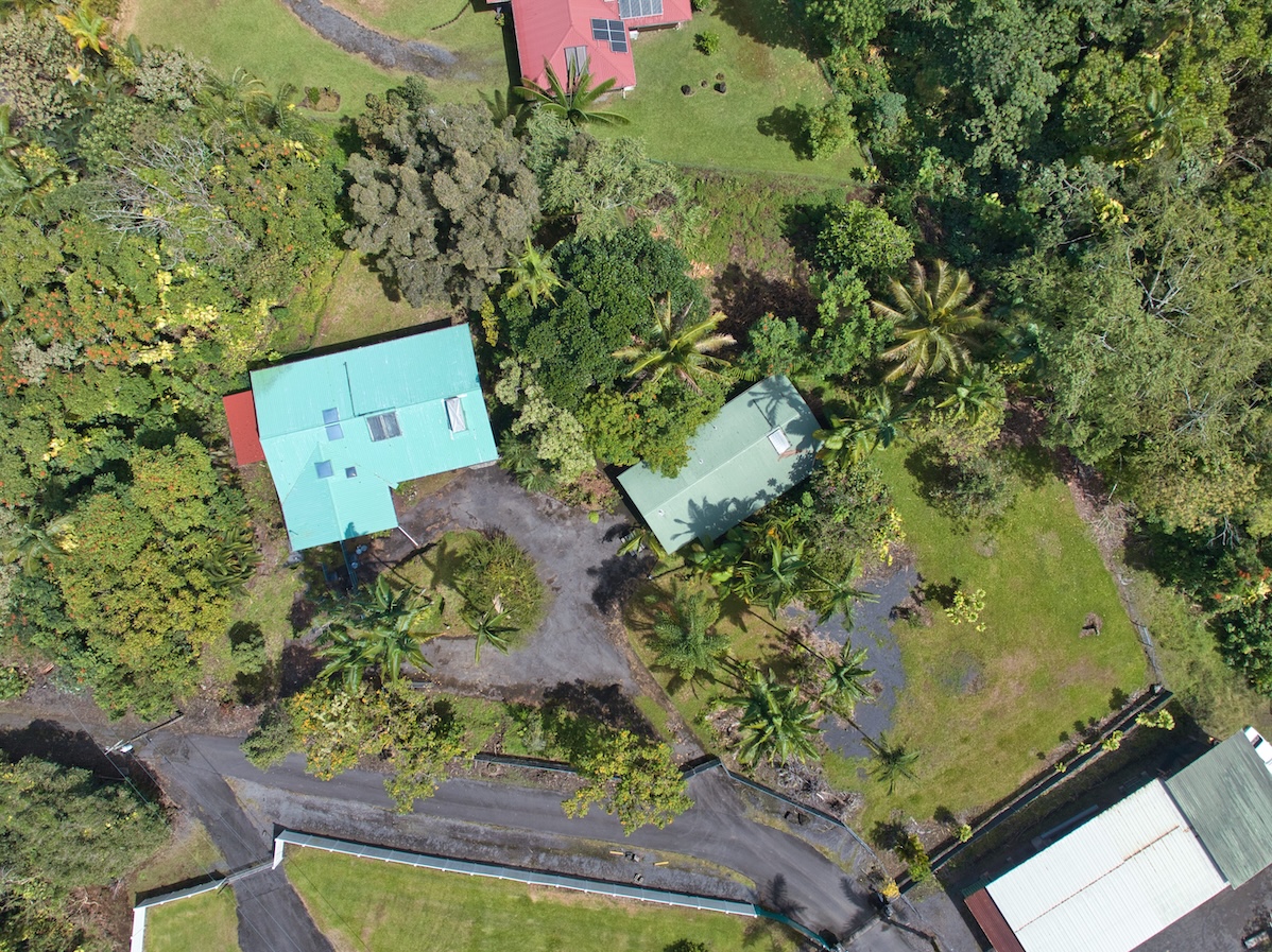 173 Opio Road Hilo, HI 96720 - Photo 2 of 27 an aerial view of a house with a yard