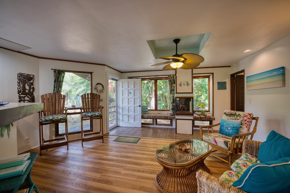 173 Opio Road Hilo, HI 96720 - Photo 4 of 27 a dining room with furniture window wooden floor