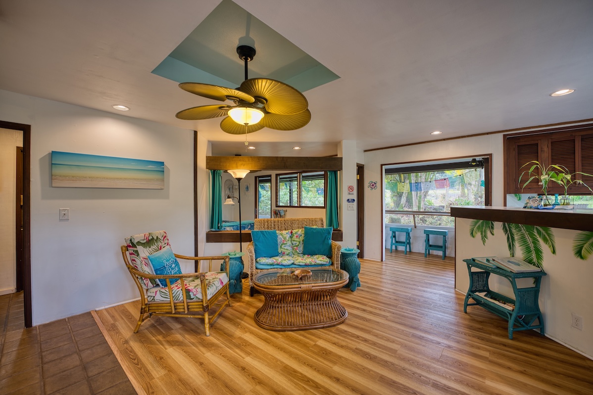 173 Opio Road Hilo, HI 96720 - Photo 5 of 27 a dining room with furniture and wooden floor