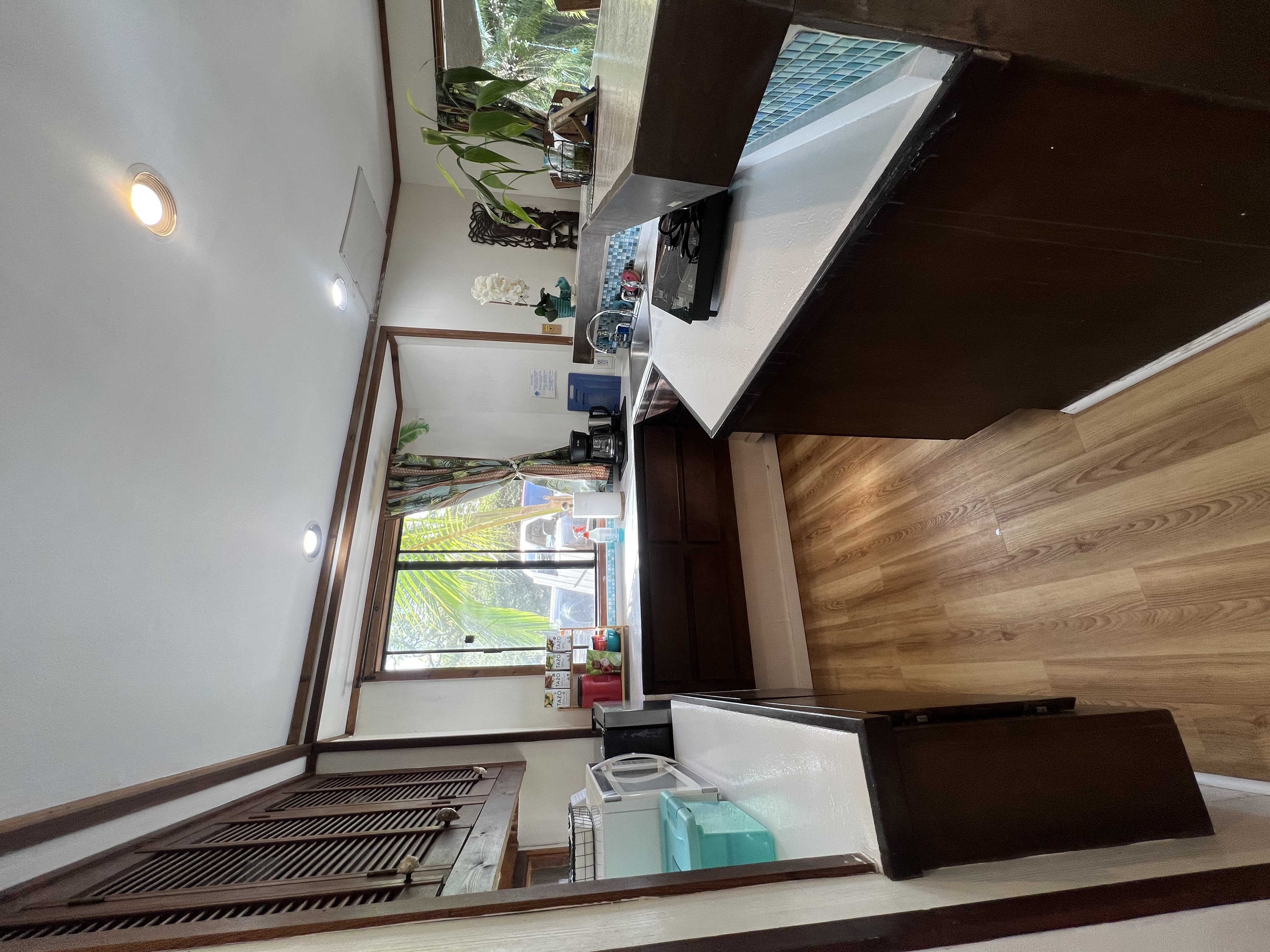 173 Opio Road Hilo, HI 96720 - Photo 6 of 27 a kitchen with sink and large window
