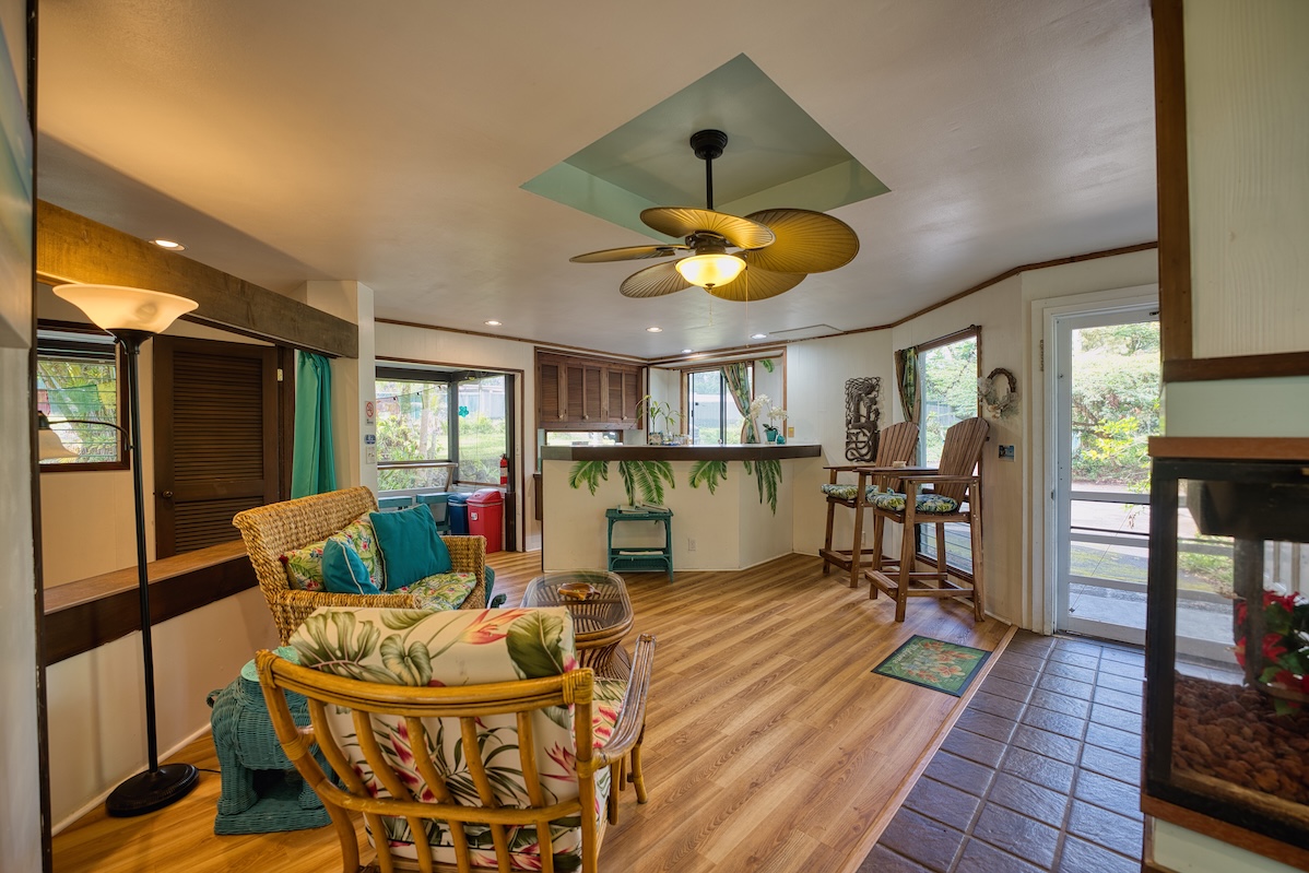 173 Opio Road Hilo, HI 96720 - Photo 8 of 27 a living room with furniture and wooden floor