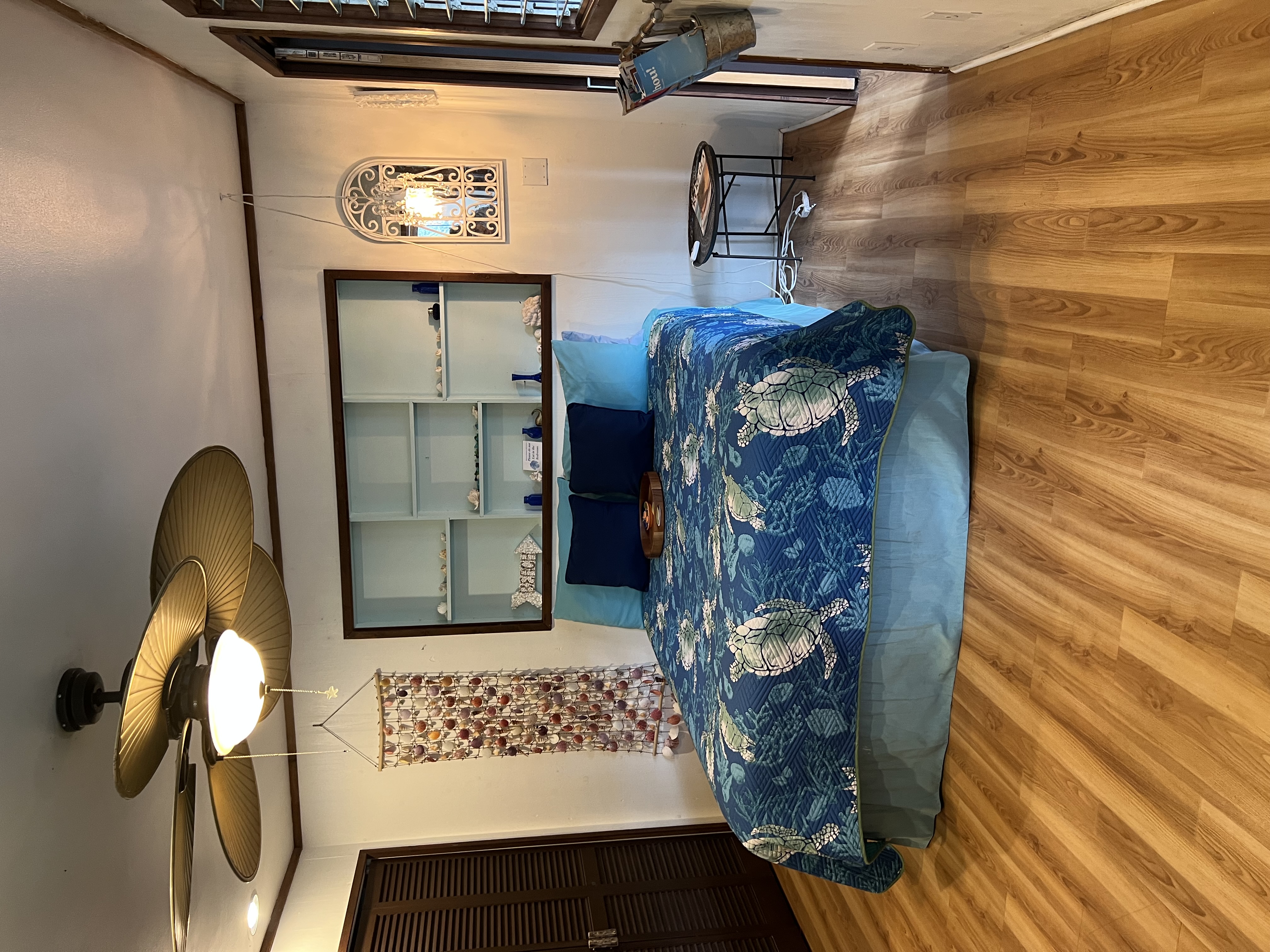 173 Opio Road Hilo, HI 96720 - Photo 10 of 27 a bed sitting in a bedroom next to a window