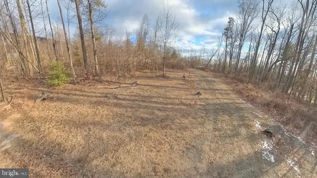an aerial view of a house with parking space