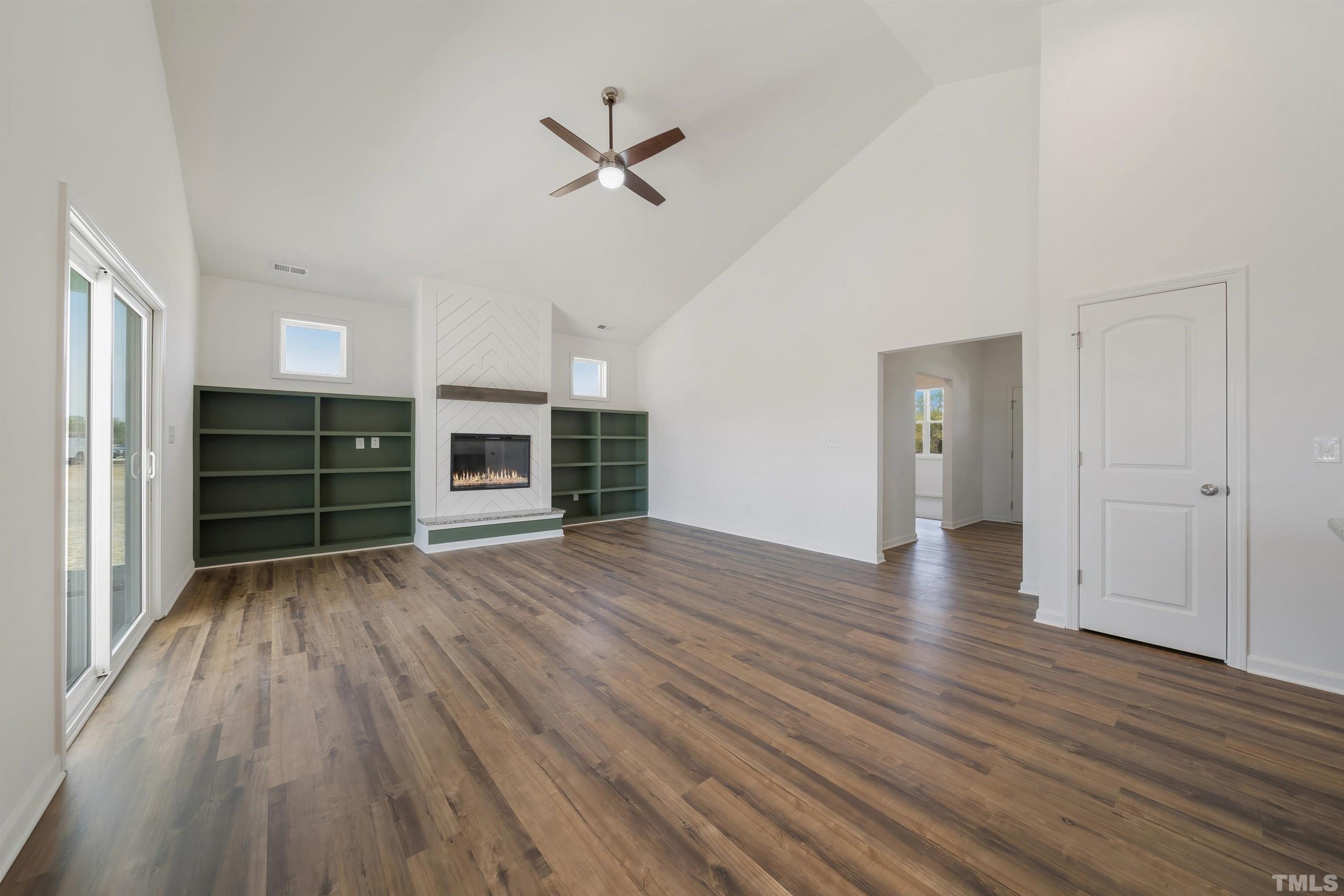4143 Needham Road Bailey, NC 27807 - Photo 3 of 25 an empty room with wooden floor closet and windows