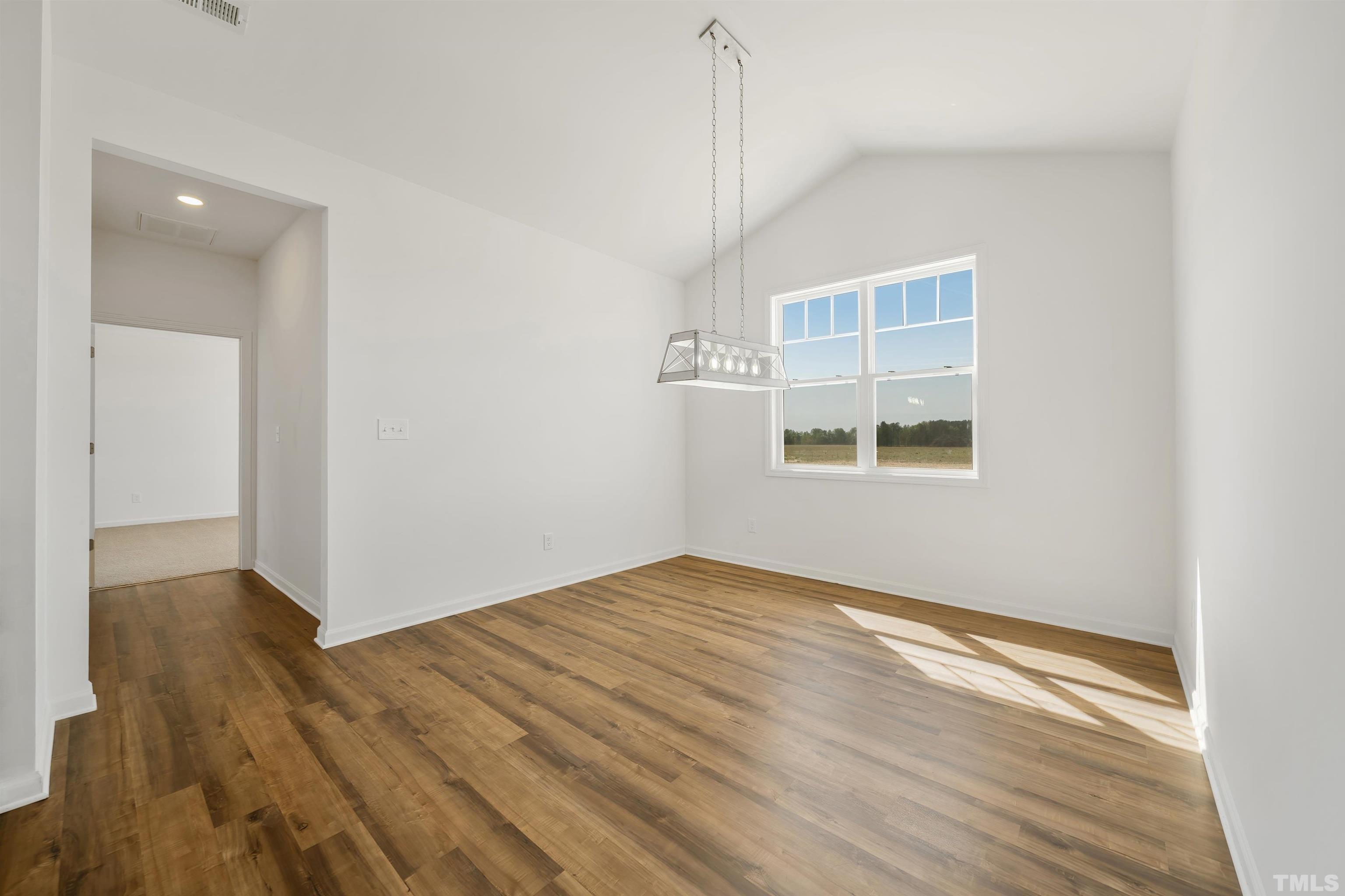 4143 Needham Road Bailey, NC 27807 - Photo 8 of 25 wooden floor in an empty room with a window