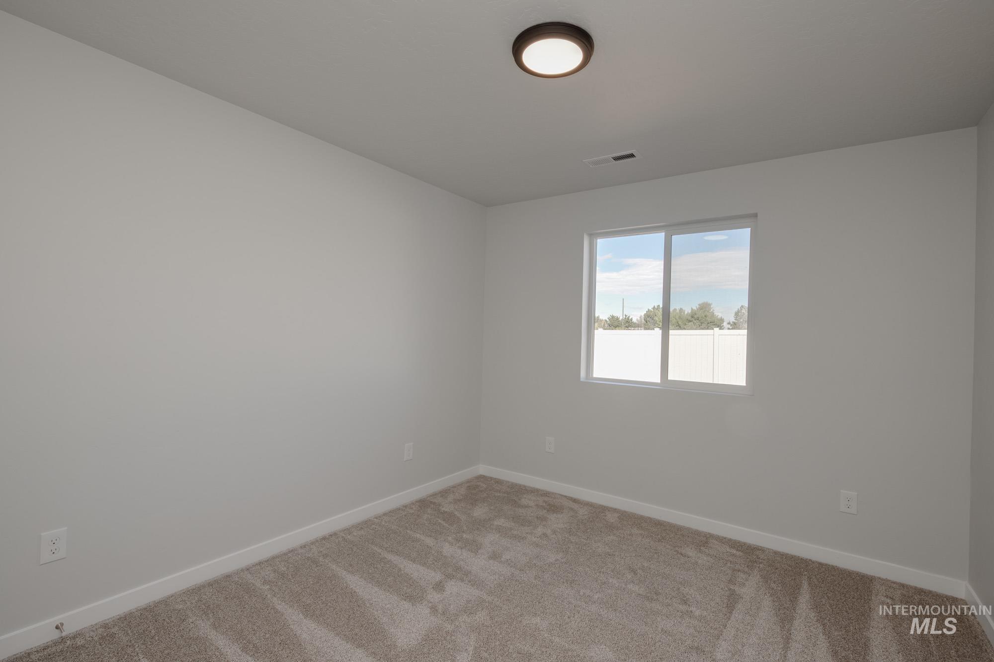 3270 West Morere Drive Meridian, ID 83642 - Photo 14 of 26 Spare room featuring carpet and baseboards