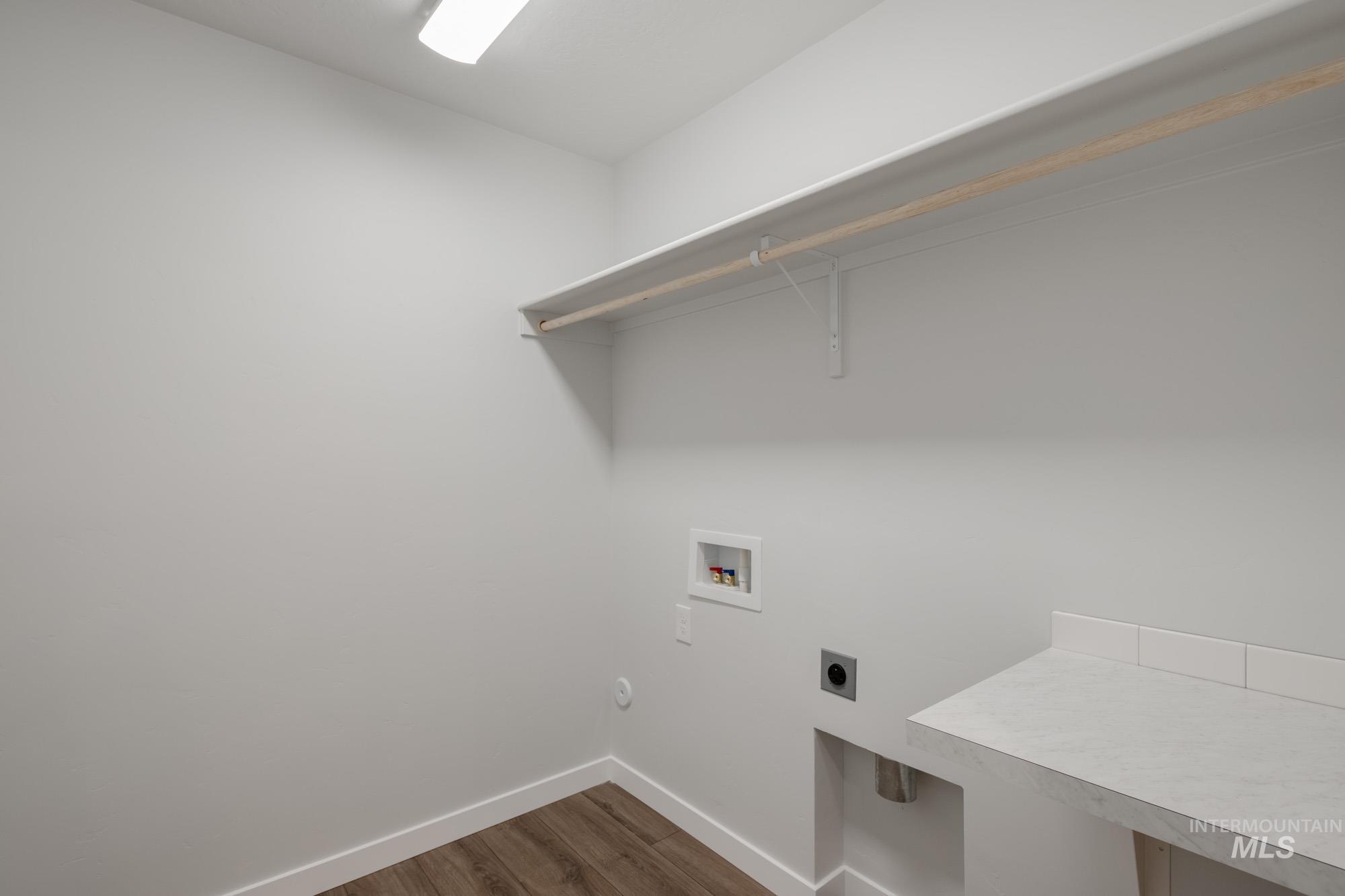 3270 West Morere Drive Meridian, ID 83642 - Photo 15 of 26 Laundry area featuring dark wood-style floors, washer hookup, and hookup for an electric dryer