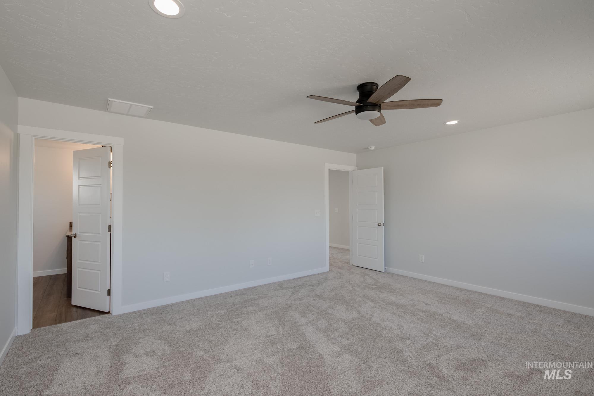3270 West Morere Drive Meridian, ID 83642 - Photo 17 of 26 Carpeted empty room featuring recessed lighting and ceiling fan