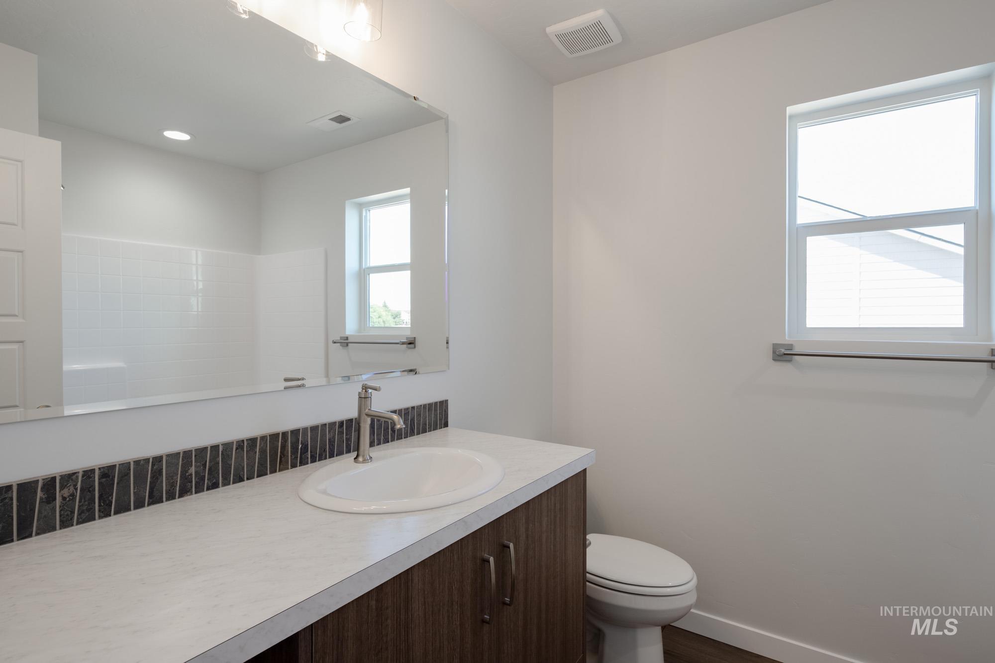 3270 West Morere Drive Meridian, ID 83642 - Photo 20 of 26 Bathroom with vanity and dark wood-type flooring