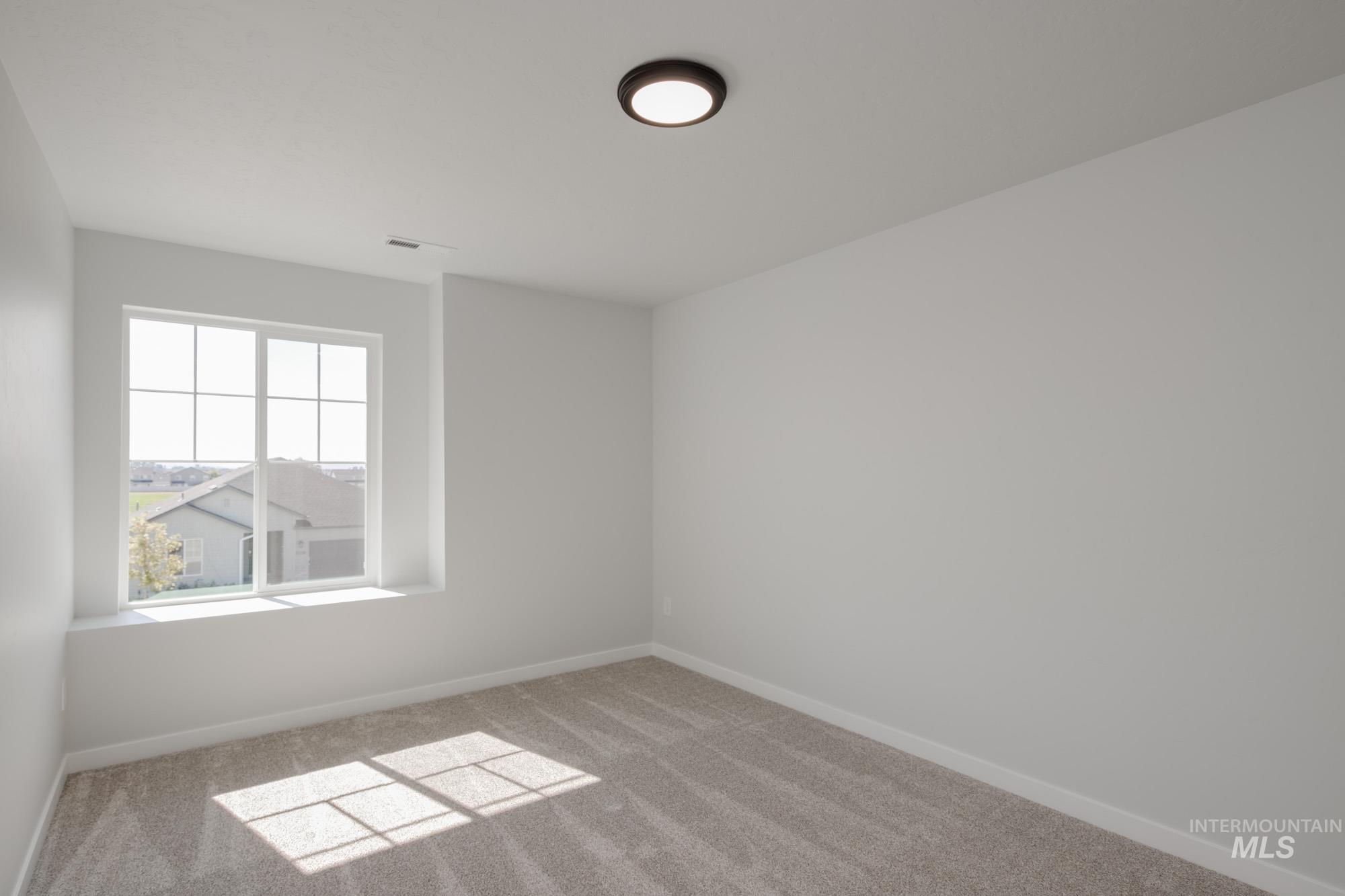 3270 West Morere Drive Meridian, ID 83642 - Photo 22 of 26 Empty room with carpet floors and baseboards